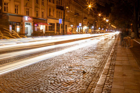 Lviv, Ukraine - August 27, 2020: view of the night city street long exposureの写真素材