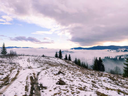 view of sunrise above snowed winter carpathian mountains copy space