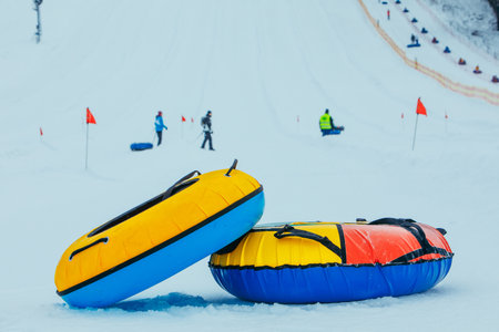 snow tubing rings close up. hill on backgroundの写真素材