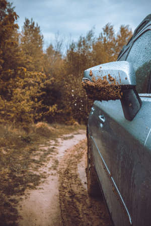 car mirror in mud close up. off road tripの写真素材