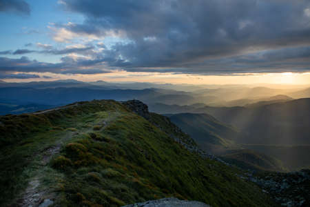 view of sunset above mountains peak. copy space