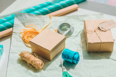 packing gift box with wrapping paper copy spaceの写真素材