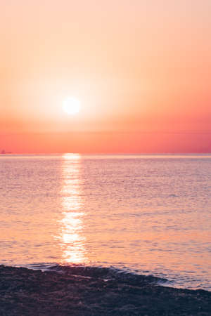 view of sunrise above the sandy sea beach. copy space