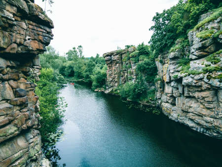 river in canyon high stone cliff copy space
