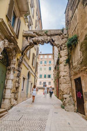 Rijeka, Croatia - June 4, 2019: people walking by old european streetのeditorial素材