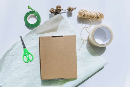 packing gift box with wrapping paper copy spaceの写真素材