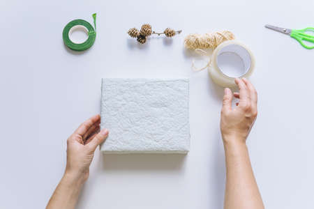packing gift box with wrapping paper copy spaceの写真素材