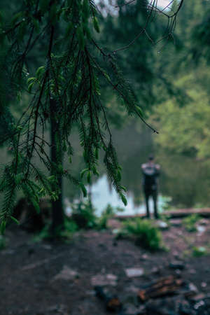 strong man hiker looking at mountain lake travel concept copy spaceの写真素材