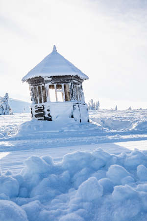view of snowed house construction in mountains copy spaceの写真素材
