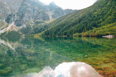 landscape view of autumn lake in mountains sunny daysの写真素材