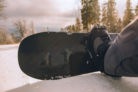 close up man boots strap in snowboard copy spaceの写真素材