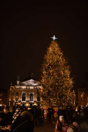 Lviv, Ukraine - January 3, 2021: overhead view of people walking by christmas fair copy spaceの写真素材