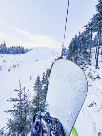 view from ski chair lift in mountains copy spaceの写真素材