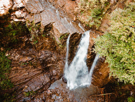 aerial view of waterfall in forest copy space