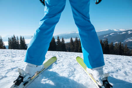 woman skier portrait with ski on the top of the mountains winter vacationの写真素材