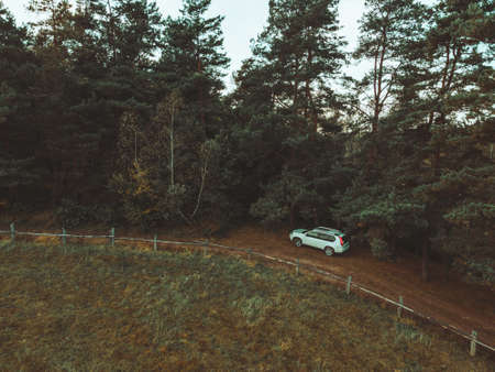 aerial view of suv car near farm fenceの写真素材