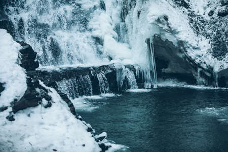 winter frozen waterfall close up. ice and waterの写真素材