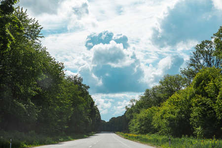 speedway at summertime cloudy sunny day copy spaceの写真素材