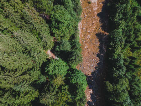 aerial view of quad bike riders at mountain trail road copy space