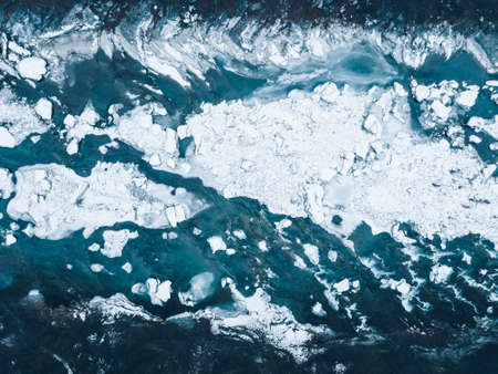 overhead top view of frozen mountains river creek copy spaceの写真素材