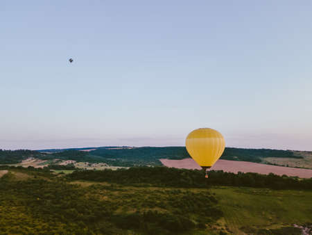 view of air balloon with basket flies on sunset copy spaceの写真素材