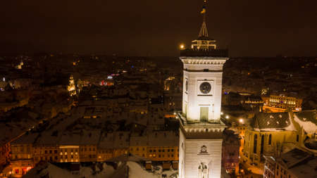aerial view of night winter lviv city center covered by snowの写真素材