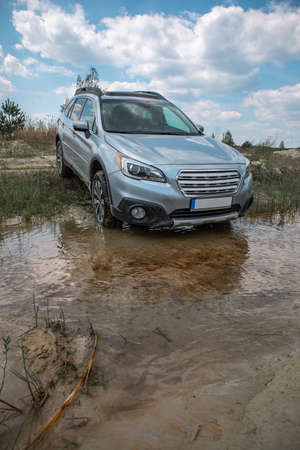 off road concept. car overcoming swamp barrier. copy space