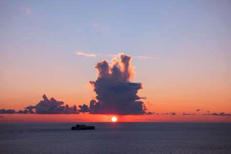 big ship on sunset in the seaの写真素材