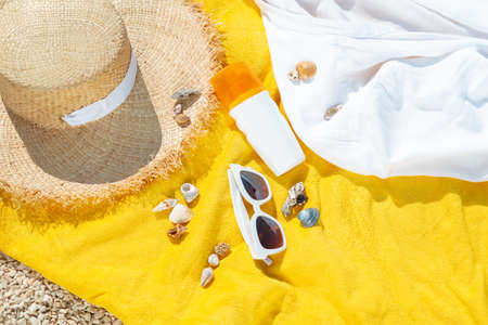 view of yellow blanket with beach stuff. summer vacationの写真素材