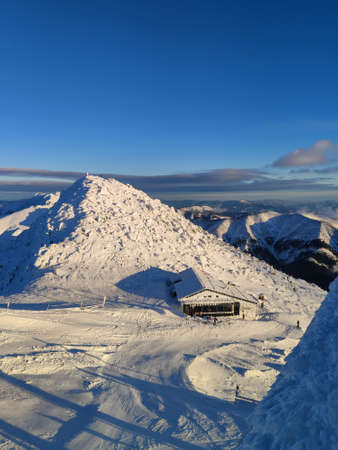 cafe on the top of ski resort mountains on sunsetの写真素材