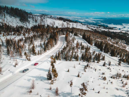 aerial view of snowed road in tatra mountains car travel conceptの写真素材