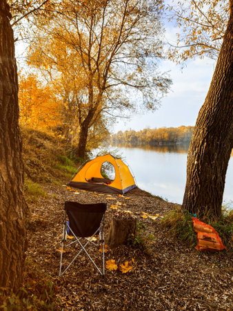autumn camping site near lake copy spaceの写真素材