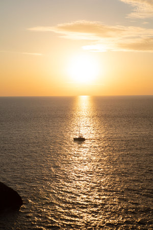 boat on sunset in the seaの写真素材
