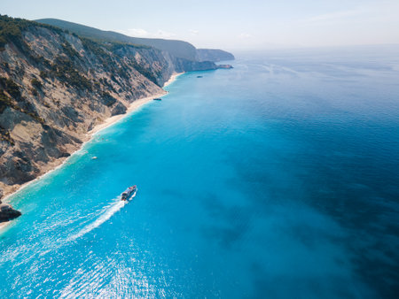 aerial view of small cruise boat sailing around Lefkada islandの写真素材