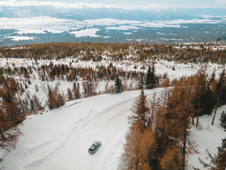 aerial view of snowed road in tatra mountainsの写真素材
