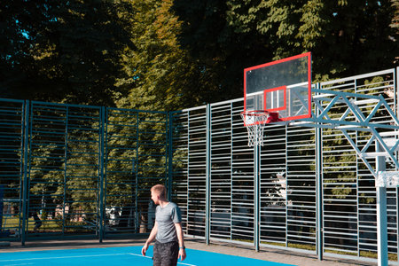 man basketball player outdoors at sport court