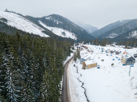 aerial view of snowed road in tatra mountainsの写真素材