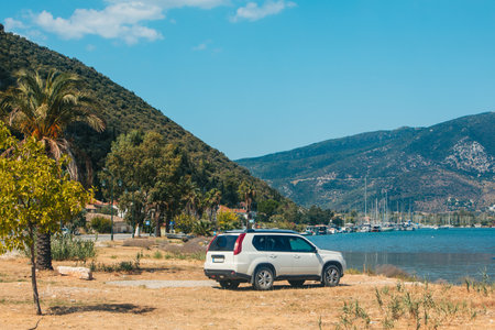 suv car at the beach of sea bay Lefkada islandの写真素材