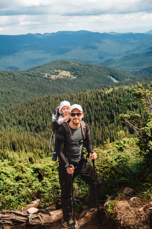 A man with a baby on the mountainの写真素材