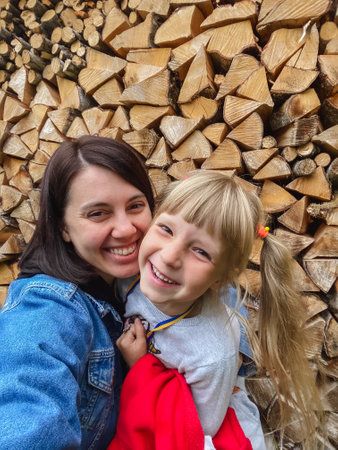 mother with daughter taking selfie