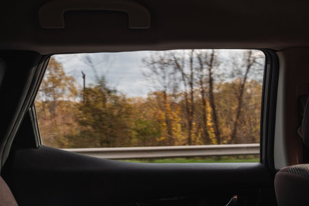side view from the car of autumn highwayの写真素材