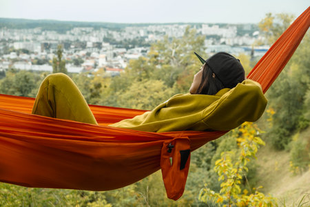 chilling woman laying down in hammock