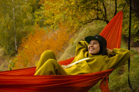 chilling woman laying down in hammockの写真素材