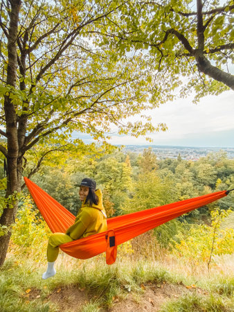 chilling woman laying down in hammockの写真素材