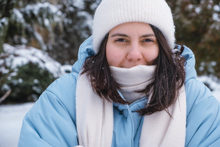 portrait of the woman get frozen outdoors at cold winter day