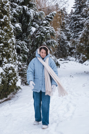 portrait of happy beautiful woman outside at cold winter dayの写真素材