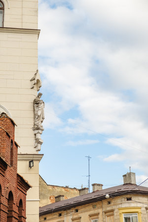 statue at old european buildingの写真素材