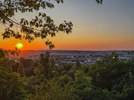 sunset overlooking the city and the parkの写真素材