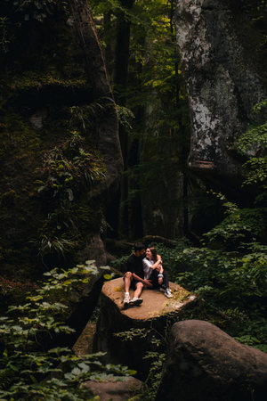 couple tourists hiking at canyon in the forestの写真素材