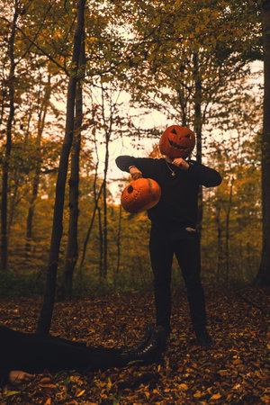 man with pumpkin head halloween costumeの写真素材
